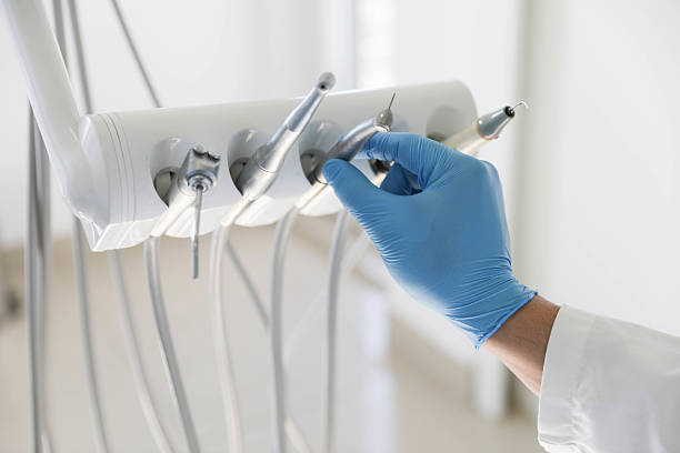 Professional Tooth Extraction technician working in Home Garden, CA